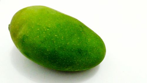 Close-up of green apple against white background