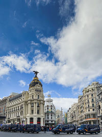 Buildings in city against sky