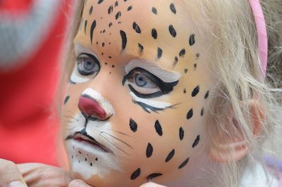 Close-up of girl with face paint