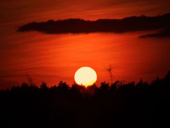 Scenic view of silhouette landscape against romantic sky at sunset