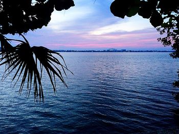 Scenic view of sea against sky at sunset