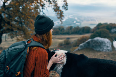 Rear view of woman wearing mask outdoors