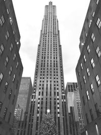 Low angle view of buildings in city against sky