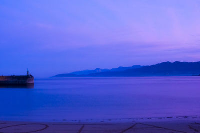 Scenic view of sea against sky at sunset