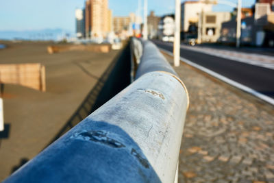 Close-up of railing at the beach