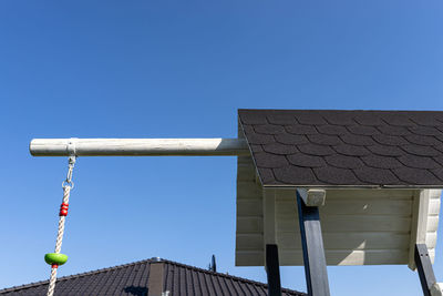 Low angle view of building against clear blue sky