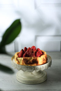 Close-up of strawberries in plate on table