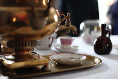 Close-up of coffee served on table at cafe