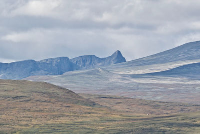 Scenic view of landscape and mountains against sky