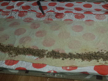 Close-up of bread on bed