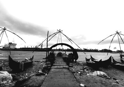 Boats in river against sky