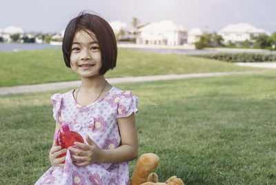 Portrait of a smiling girl on field