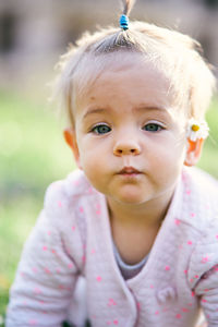 Close-up portrait of cute girl outdoors