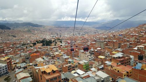 High angle view of town against cloudy sky