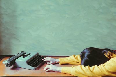 High angle view of woman lying on table