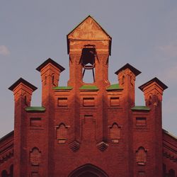 Low angle view of bell tower against sky