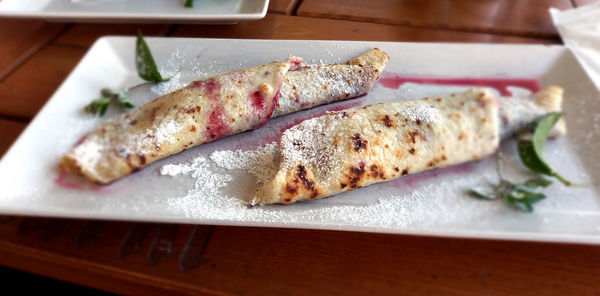 High angle view of crepes in a plate on a table.