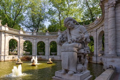 Statue in front of building