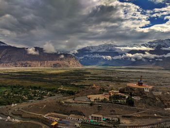 Scenic view of landscape and mountains against sky