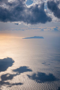 Scenic view of land against sky during sunset