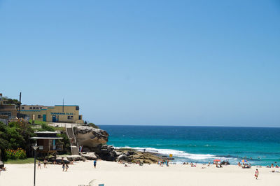 Scenic view of beach against clear sky