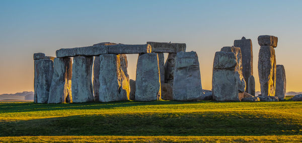 Built structure on field against clear sky