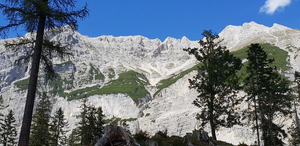 Low angle view of snow covered land against sky