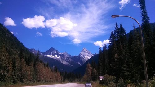 Scenic view of mountains against cloudy sky