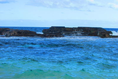 Scenic view of sea against blue sky