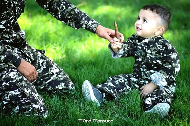 two people, nature, grass, outdoors, males, forest, responsibility, people, beauty in nature, togetherness, men, adult, camouflage clothing, day