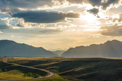 Scenic view of landscape against sky during sunset