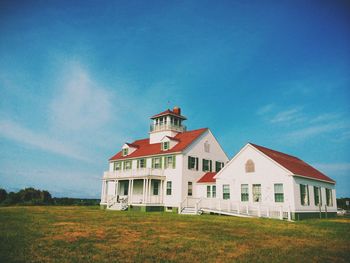 Low angle view of house on field against sky