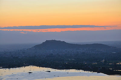 Scenic view of landscape against sky at sunset