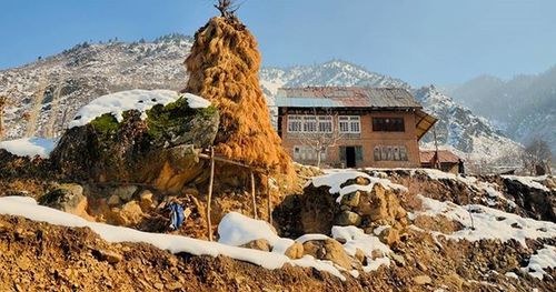 Scenic view of snow covered mountains