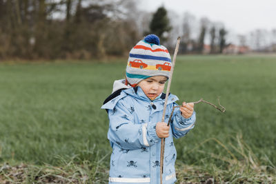 Boy wearing hat on field