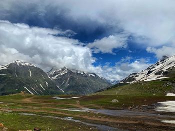 Scenic view of snowcapped mountains against sky