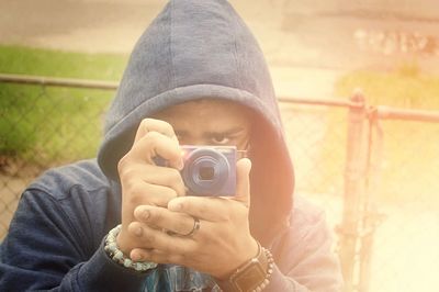 Midsection of man photographing