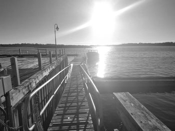 Pier over sea against sky