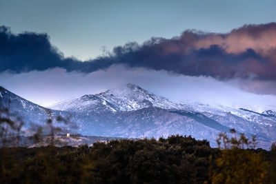 Scenic view of snowcapped mountains against sky