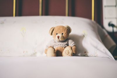 Stuffed toy on bed at home