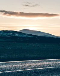 Scenic view of landscape against sky during sunset