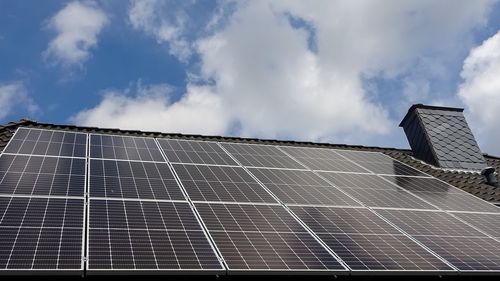 Solar panels producing clean energy on a roof of a residential house