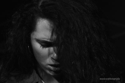 Close-up portrait of a young woman looking away