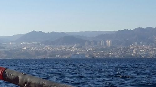 View of sea with mountain range in background