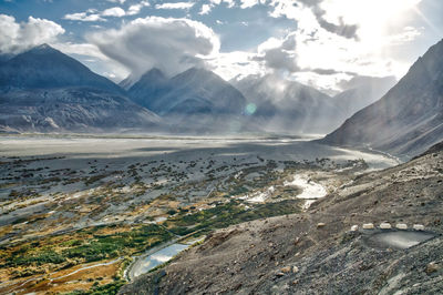 Aerial view of landscape and mountains against sky