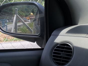 Reflection of car on side-view mirror