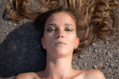 Portrait of young woman lying down