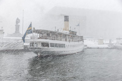 Ferry at storm on sea, skeppsbron, stockholm, sweden
