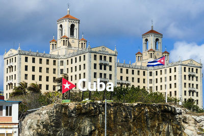 Low angle view of buildings in city against sky