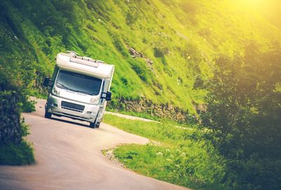 Truck on road amidst field